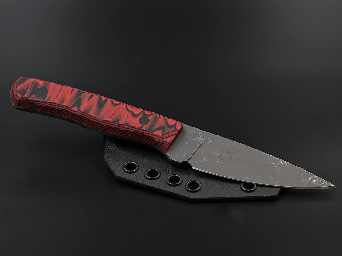 Pointy EDC knife with red black handle and stonewash finish