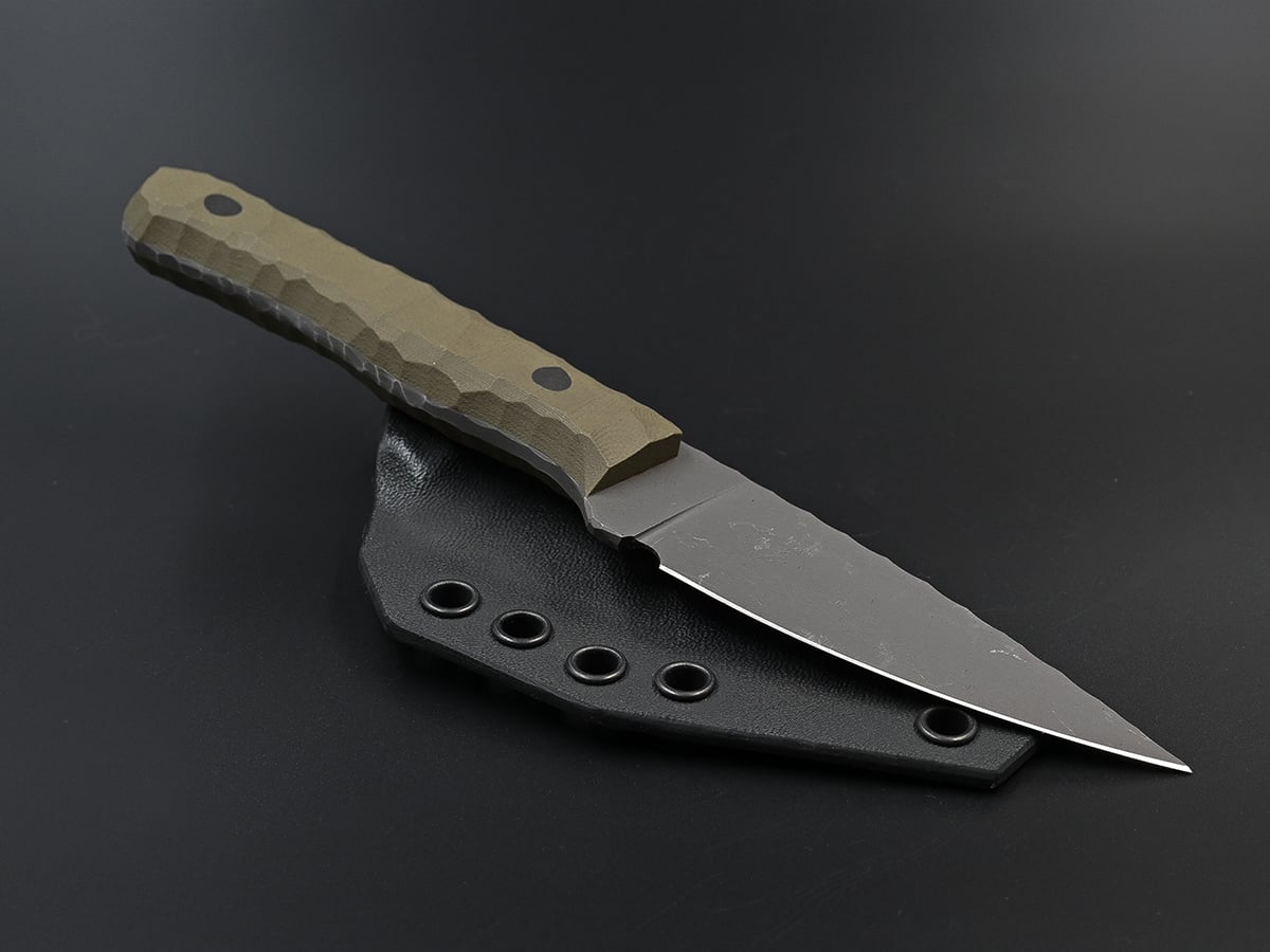 Outdoor knife for camping trips with olive green handle.
