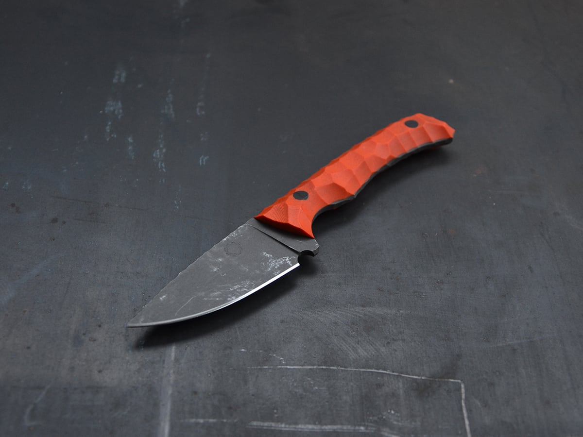 EDC knife with orange G10 handle and stonewash finish