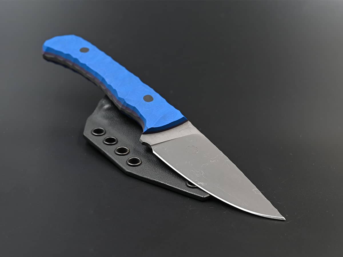 A camping and hiking knife with a big handle and stonewash finish.