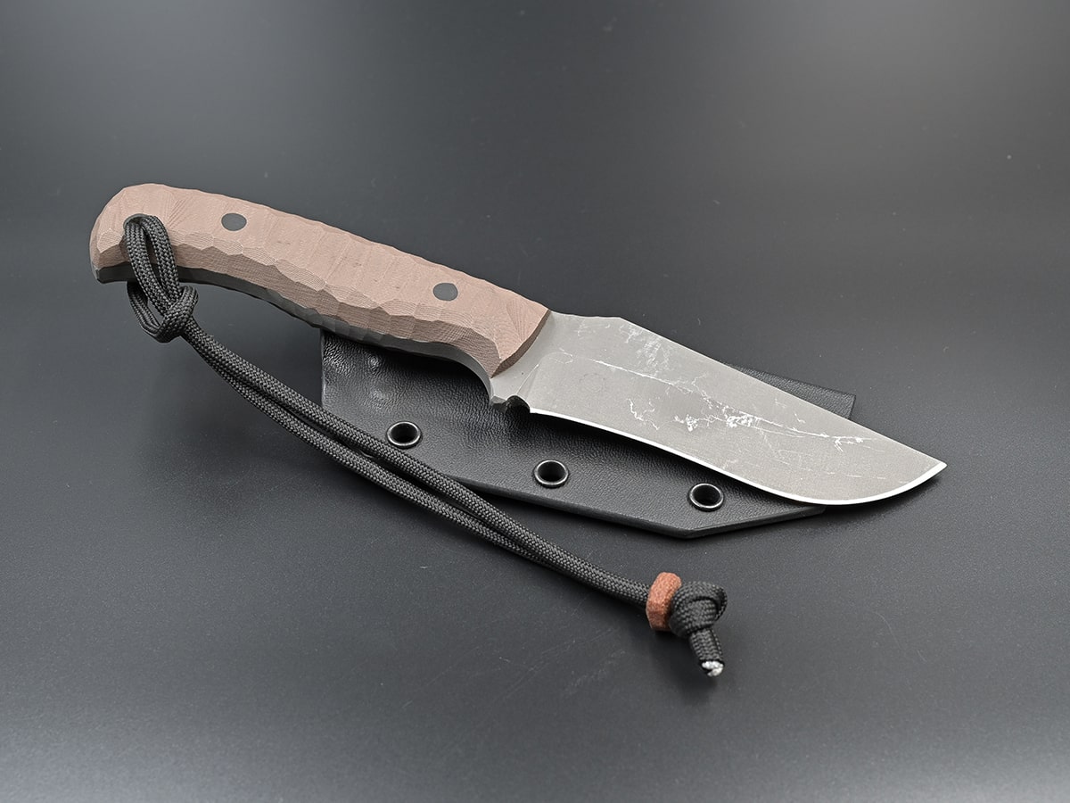 Oberon is a recurved hunting knife for skinning prey with an optional G10 handle.